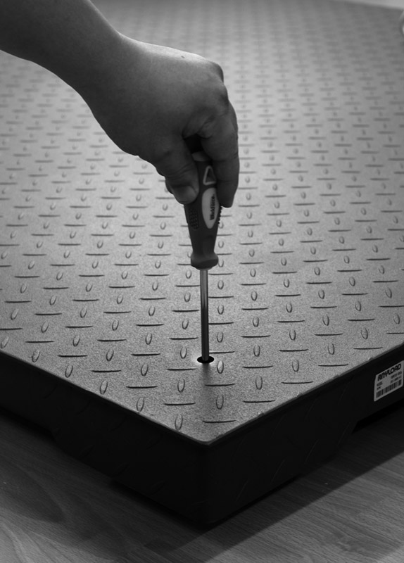 floor-scale-top-plate-access-to-adjust-the-feet-black-and-white.jpg